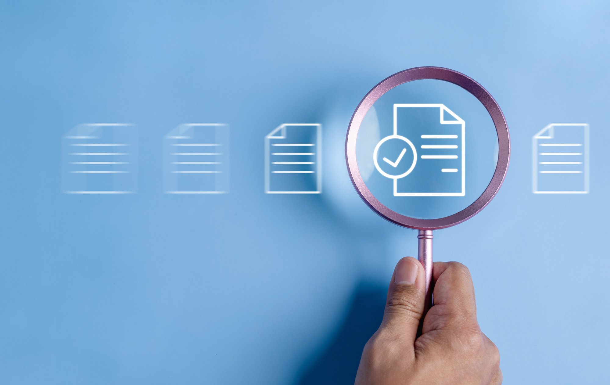 a magnifying glass over a document icon
