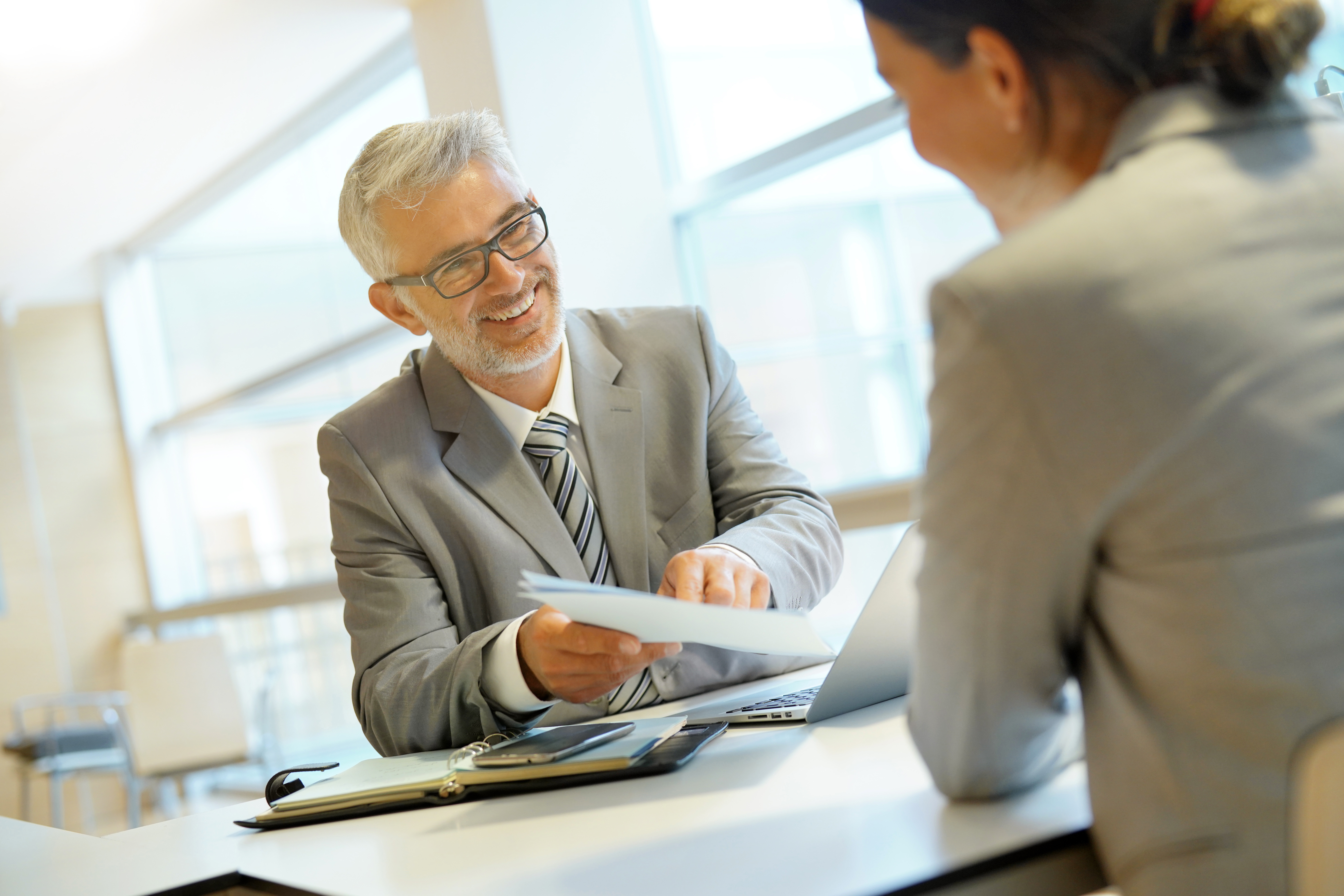 Claims adjuster talking with client